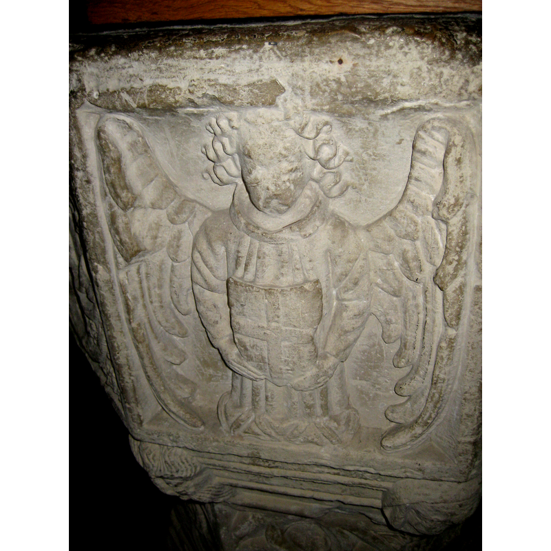 one of the four angels on the octagonal basin; emblem of St. George?