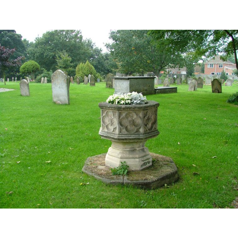 the possible-font in the churchyard, serving as a flower-pot [cf. Font notes]