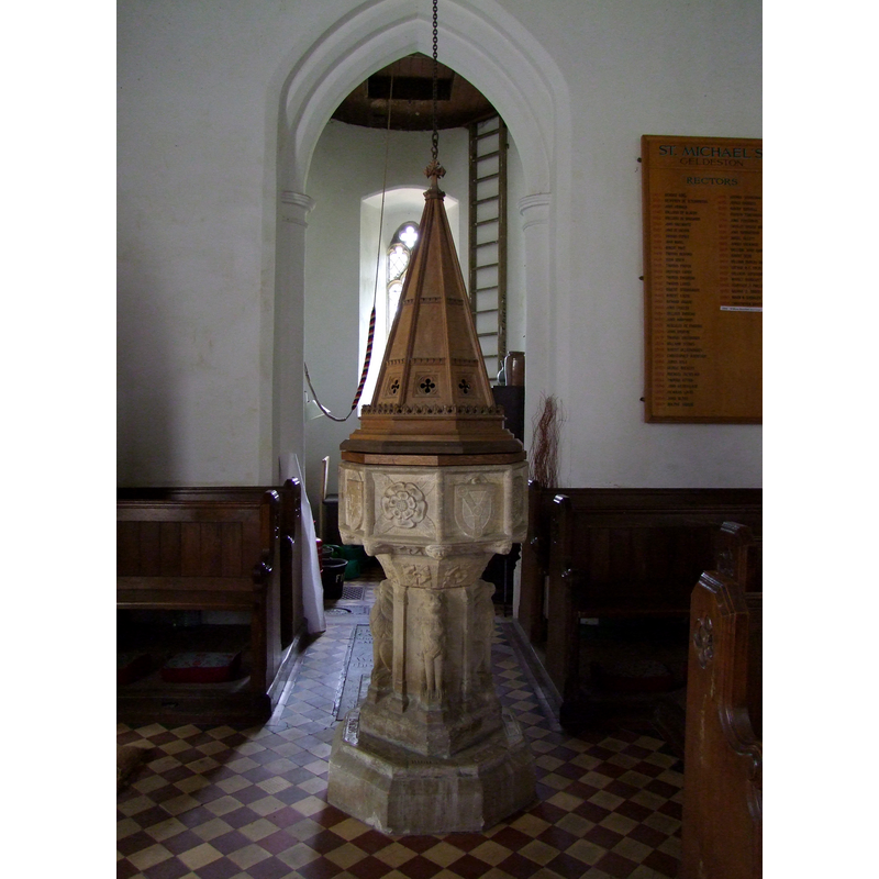 the 19th-century tall cover on top of the other flat cover; in the context of the west end of the nave and tower arch