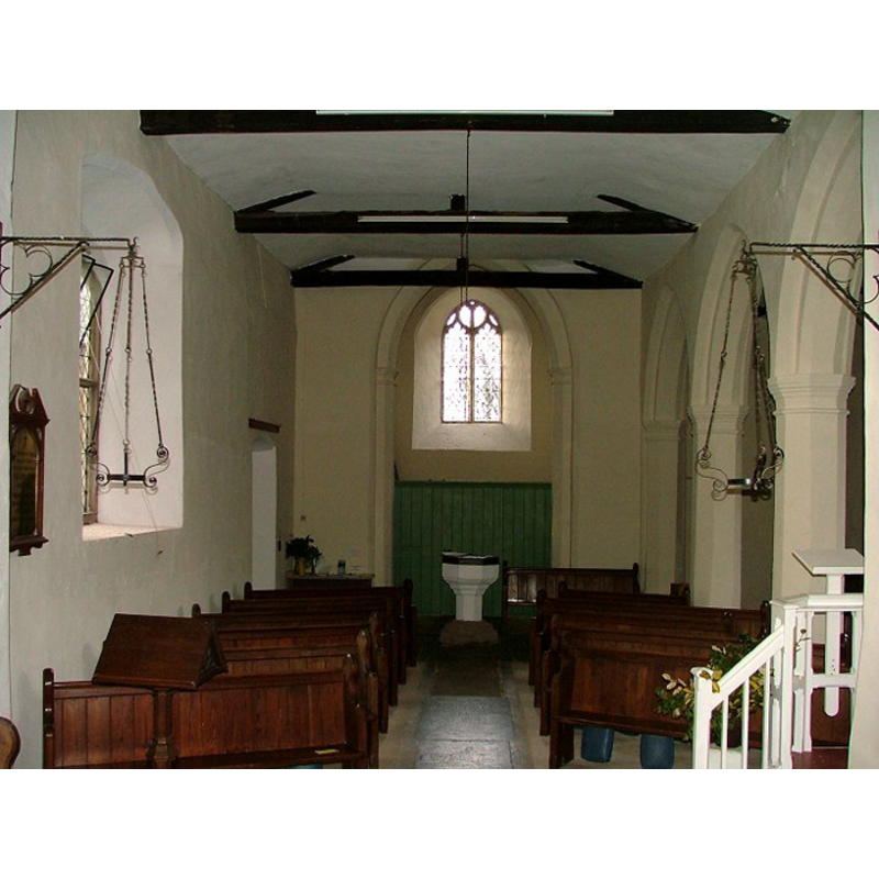 the font and cover at the west end of the nave