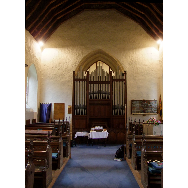 the font is partially visible at the west end, north side; there is a flower arrangement on the cover