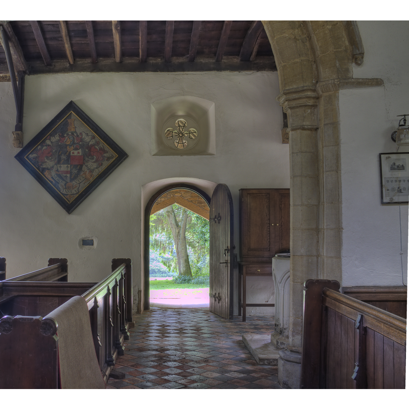 the font partly visible behind the wall, on the right