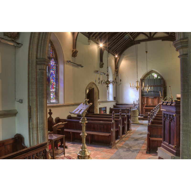 the font at the back, by the south bank of pews