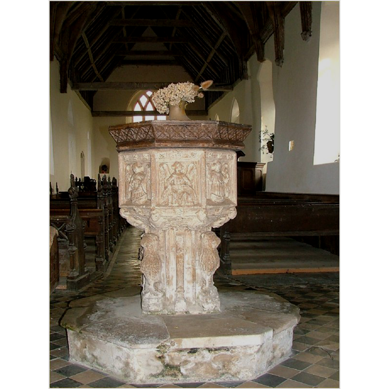 in the centre panel of the basin is Matthew's angel; the font at the west end of the nave, looking east