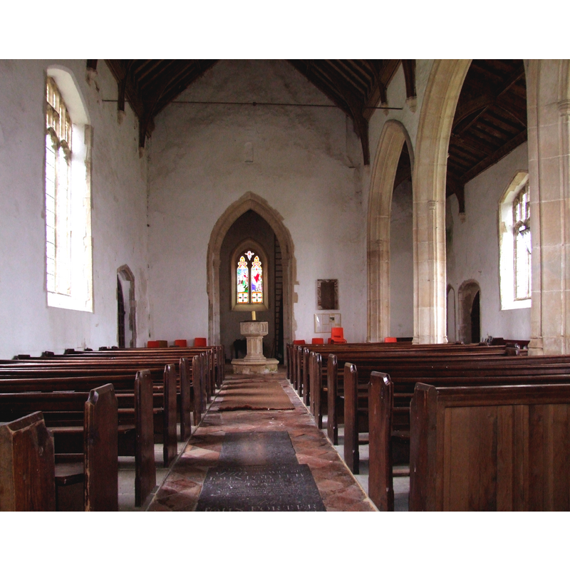 the font and cover at the west end, by the tower arch