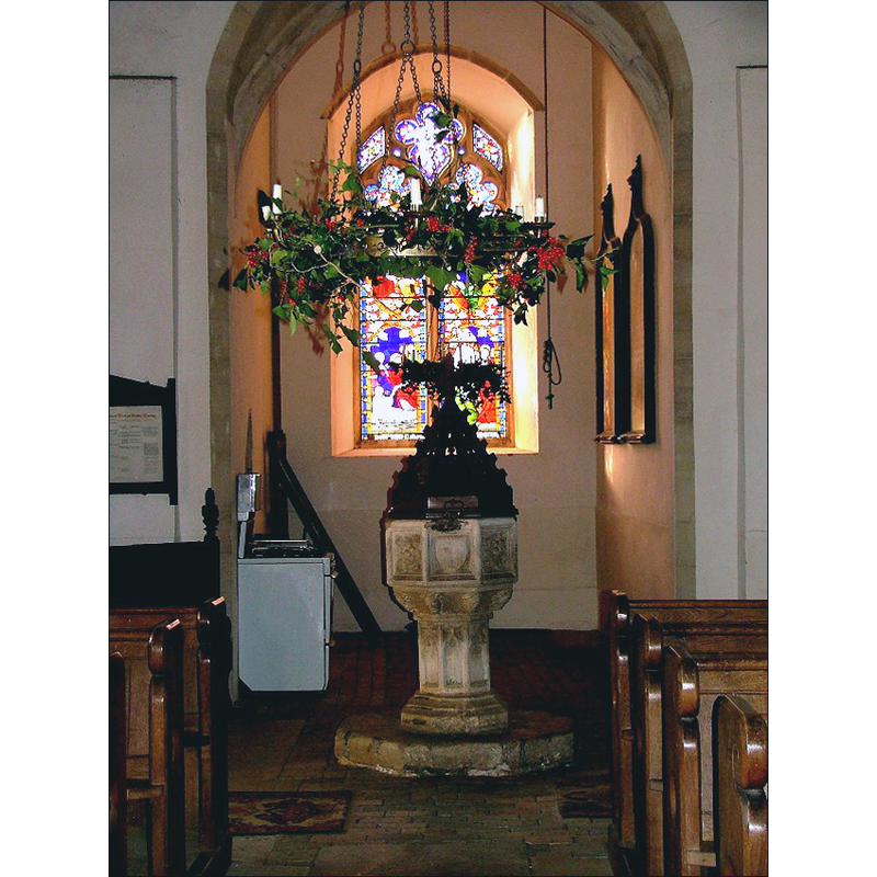 at the west end of the nave, by the tower arch