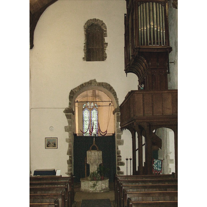 the font and cover by the tower arch