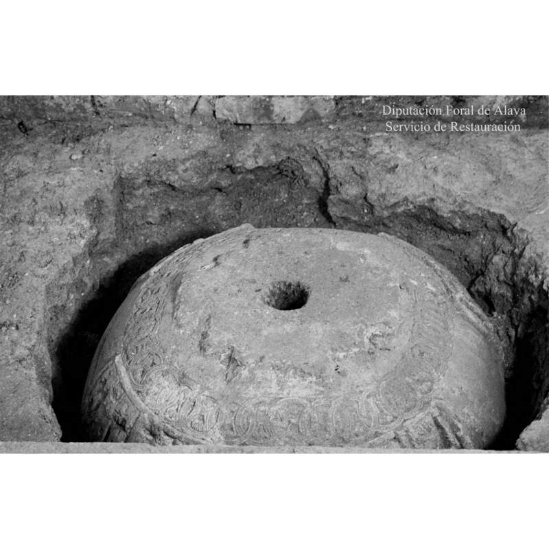 the inverted font as it was being excavated after years of burial underground and prior to its restoration