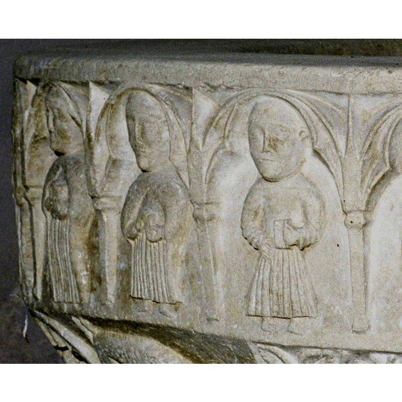 the two on the centre and right are tonsured; the one on the right is wearing the knotted cingulum characteristic of the Franciscan Order