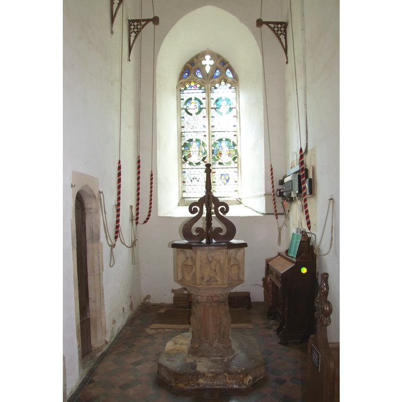 the font and cover beneath the tower
