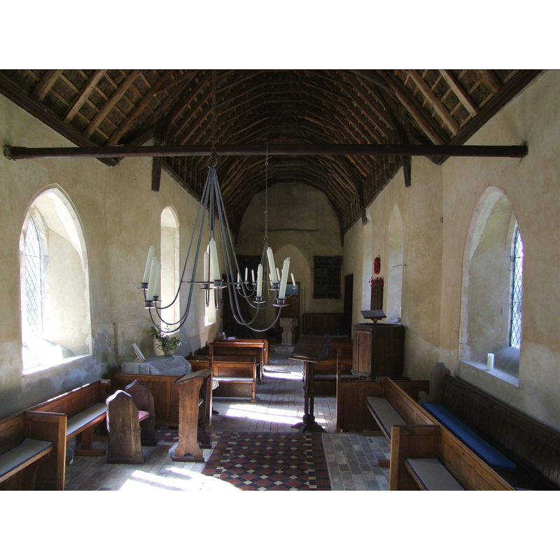 the font and cover at the west end of the nave