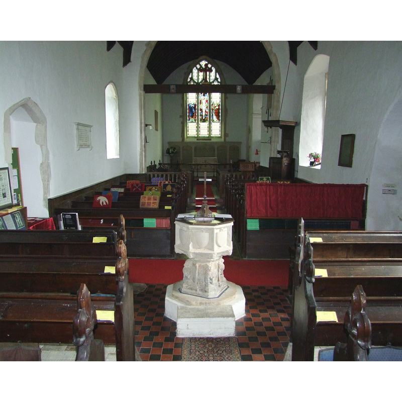 the font and cover at the west end of the nave