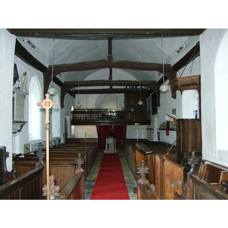 the font and cover at the west end, beneath the gallery