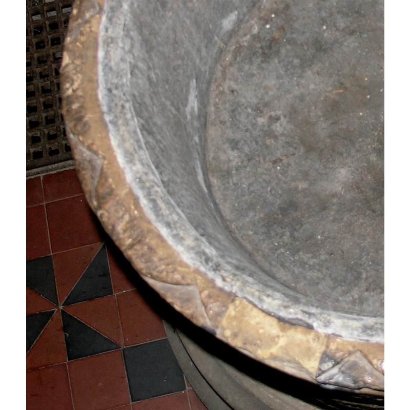 large ones, around the upper rim surface; some damaged; shows where the new-stone insert to repair the cover staple holes was made