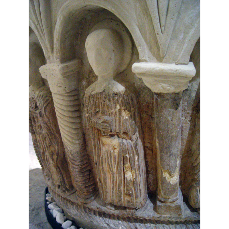 like the previous figure, this too appears to be seated; the right hand holds a book; the left hand is not visible -- photographed after the 2008 restoration