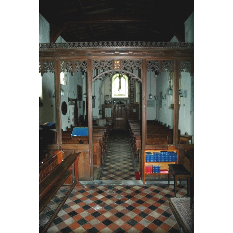 the modern font at the west end, behind the south (left) bank of pews