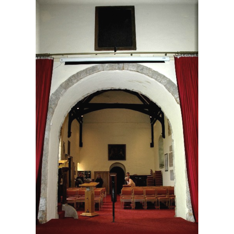 the font hidden from view on the other side of the chancel arch, north side
