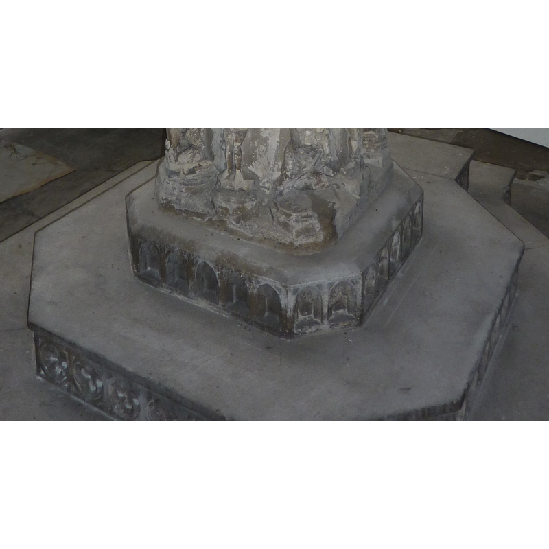 on the sides of the three-step 19th-century plinth