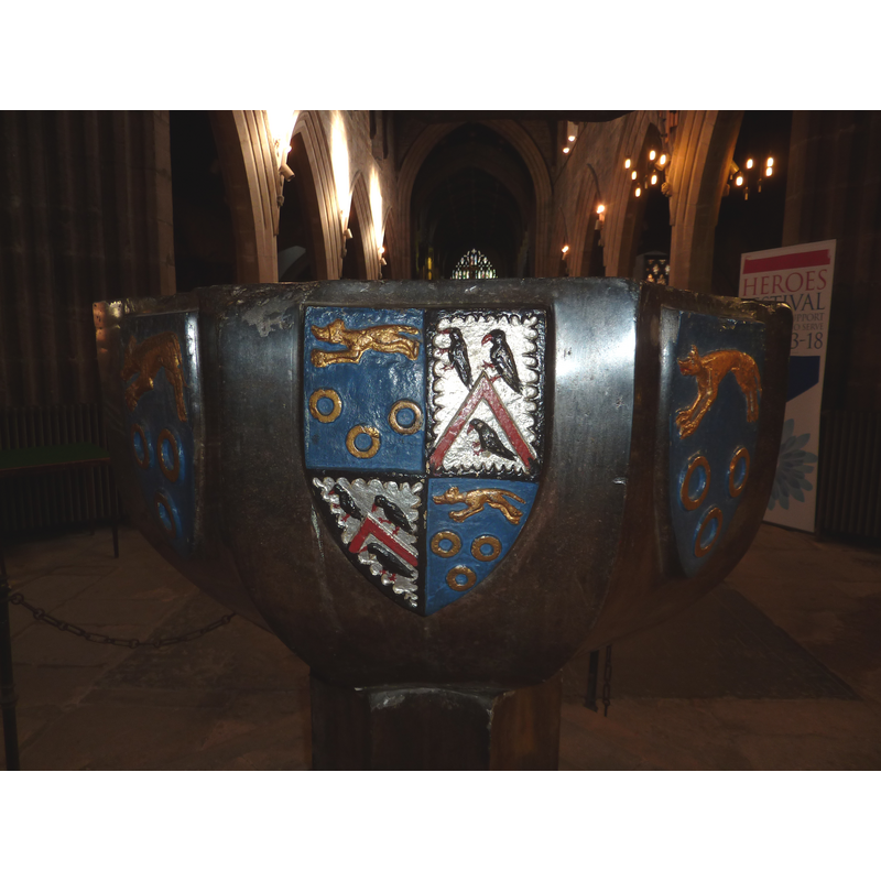 on the west side of the basin; it includes the arms of Robert Rhodes (as well as those of his wife's family?)