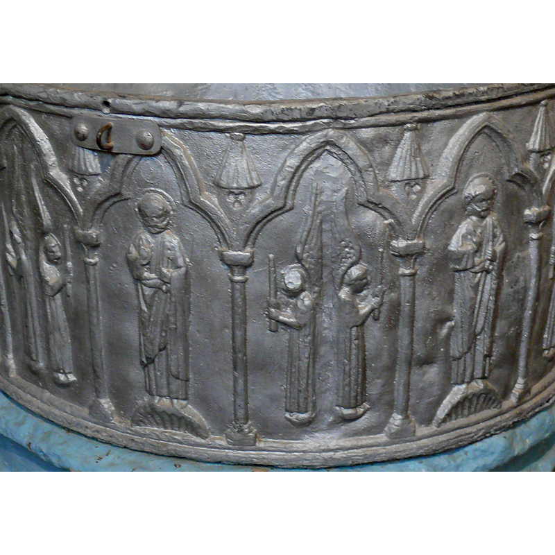 rhe one on the left is clearly St. Peter; to one on the right could be St. Paul [if a sword], or St. Bartholomew [if a flaying knife]  [cf. Font notes]