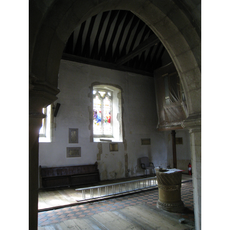 the font in the context of the nave in the preparatory stages of the 2009-2010 renovation of the church interior; photograph taken 13 August 2009