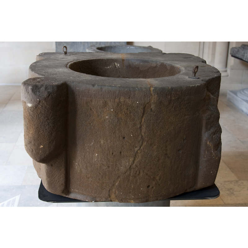 notice the damaged sections: the vertical cracks, and the broken angle protrusion where one head would have been carved [cf. Font notes]