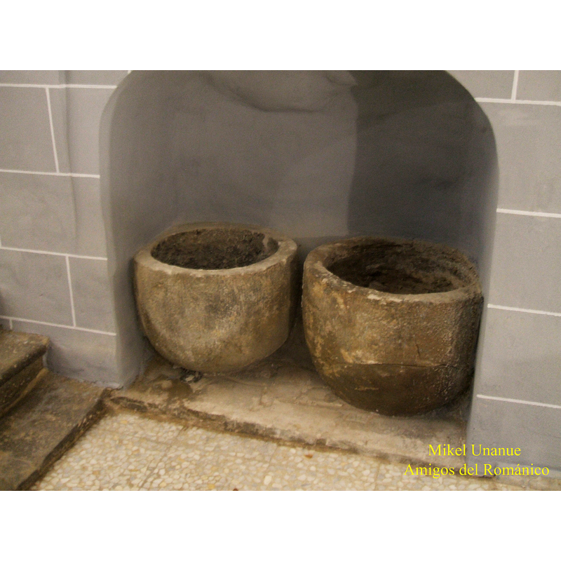 two round basins kept in this church; they may be containers that were used for tithe oil or similar