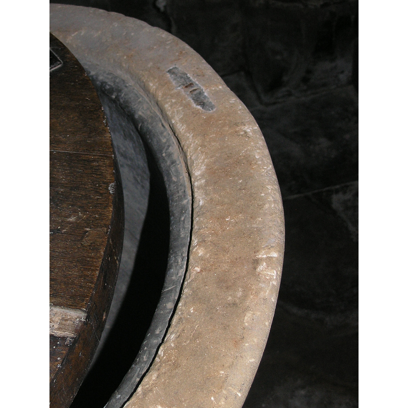 note the patina on the stone, very different from the one on the sides of the font; also the old metal staple from the old cover; this is not a modern font [cf. Font notes]
