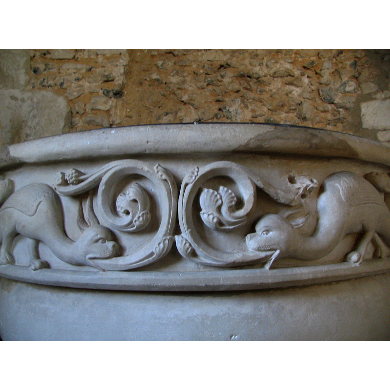 several pairs of facings dragons; each dragon has a tendril or foliage coming out of its mouth; do they represent spewing flames? re-carving