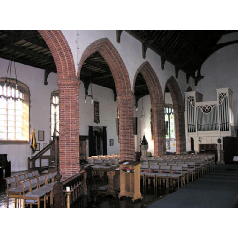 the font and cover are visible at the west end of the south aisle