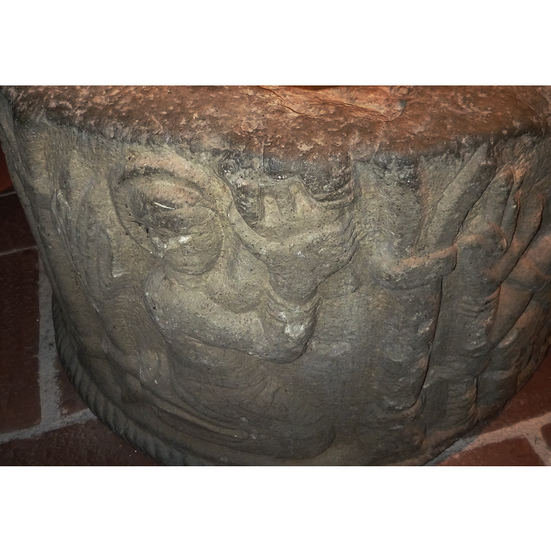 the haloed figure faces the arch to the right, in which sits Christ in majesty; the kneeling figure holds up an object that is easily identified: a chalice? a building? on the right side of the head there appears to be a long flock of hair, suggesting perhaps a feminine figure. Besides Christ it is the only haloed figure (not even Peter and Michael have haloes). Is it the Virgin? Ecclesia?