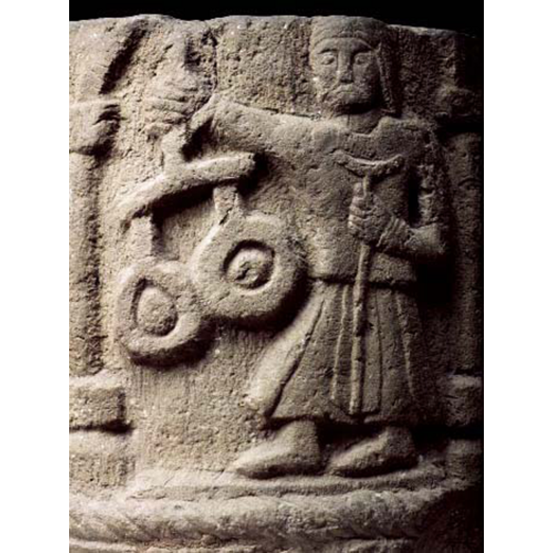 St. Michael, not haloed, holding the scales; what is the object in his left hand? Not a sword