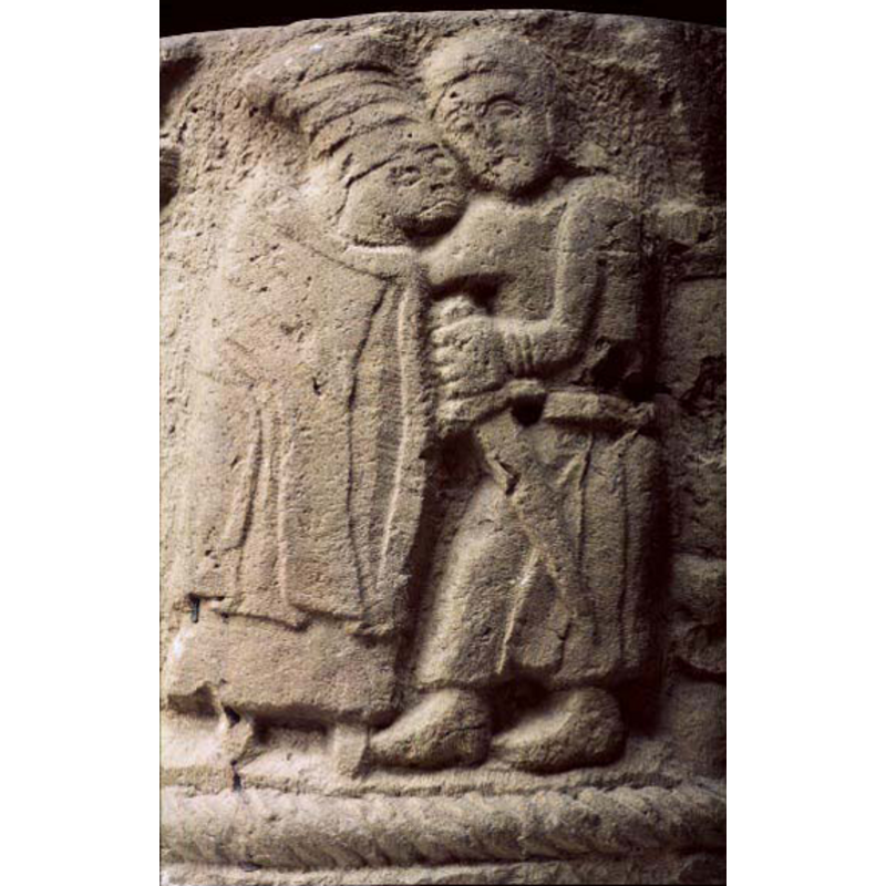 the embracing figures; the hat on the figure on the left has been identified as a woman's [cf. Font notes]