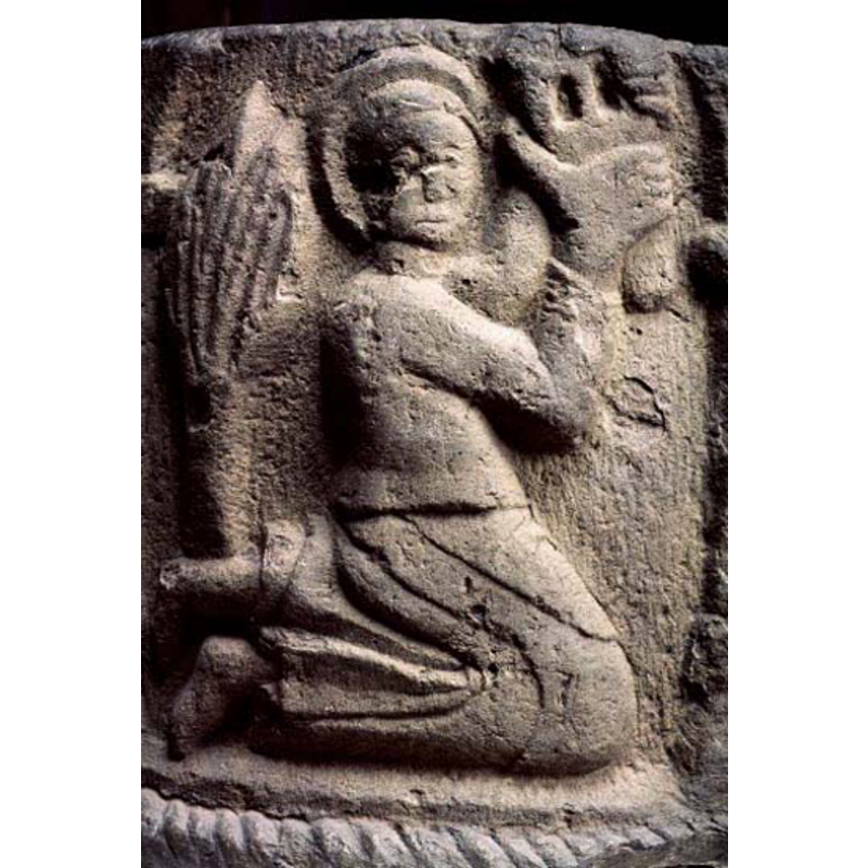 the kneeling holy figure; what is the object in her (?) hand?