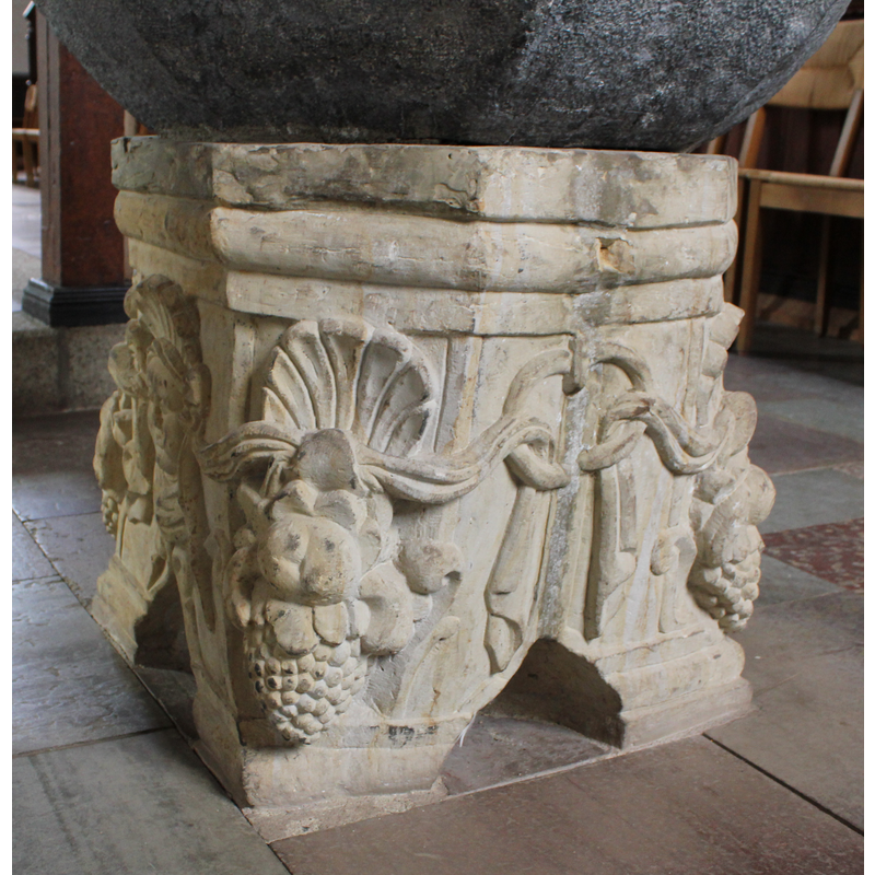 hanging from a ring on two of the sides of the base; wraps around the sides of the base