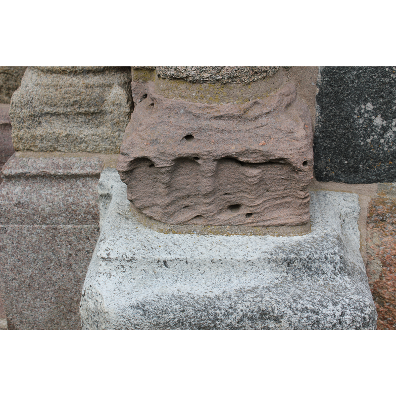 base of a pillar: the sandstone badly worn by the exposure to the elements