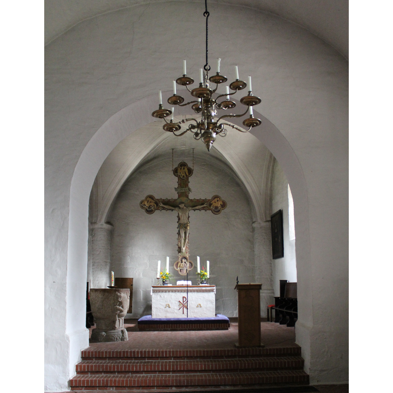 to the left (north), just inside the chancel