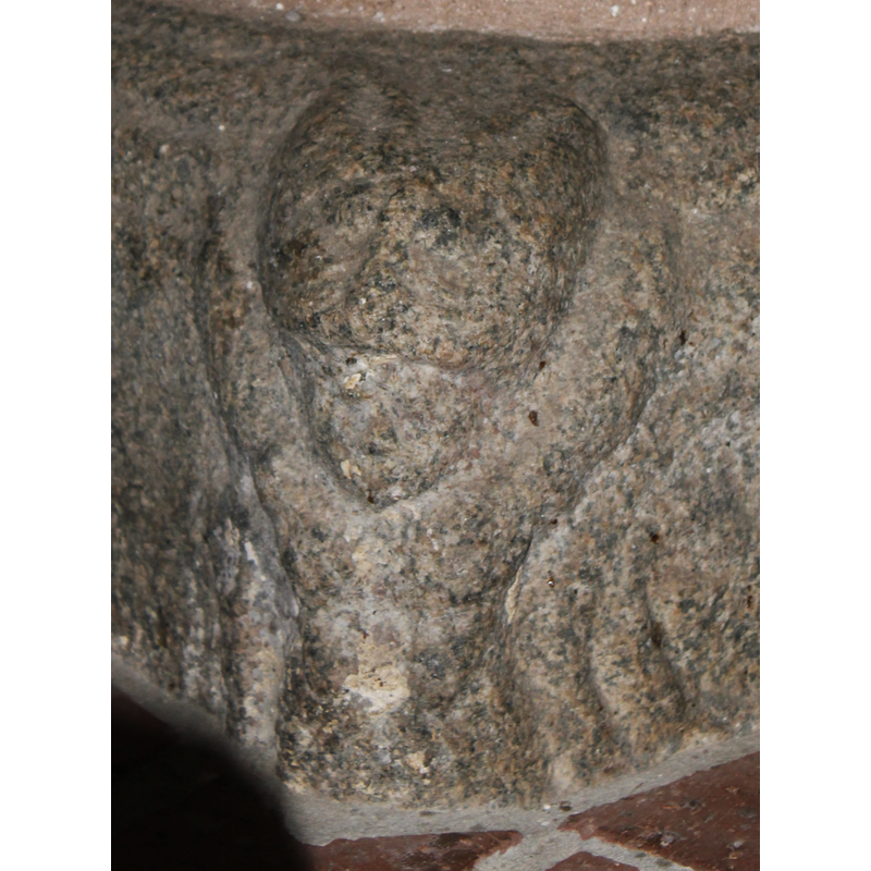 the figure appears human, though the head is too large for the body