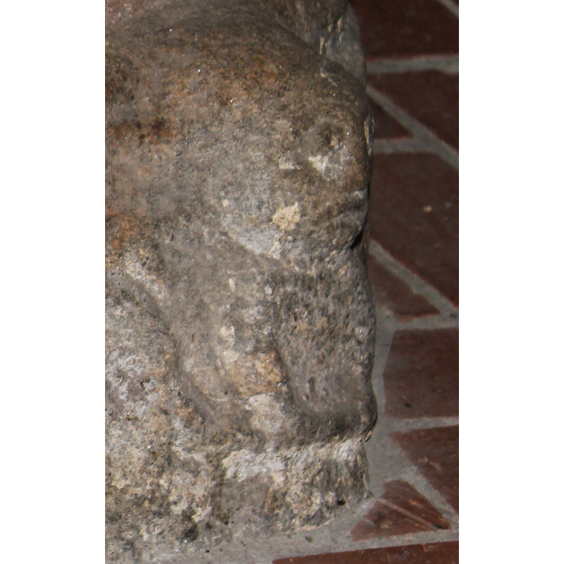 very worn; appears to be seated, with hands held low in front