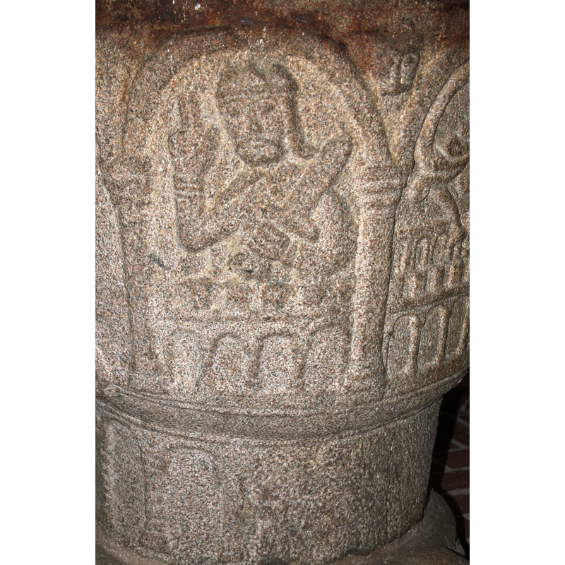 inscribed in a arch; seats on top of a blind arcade of round arches