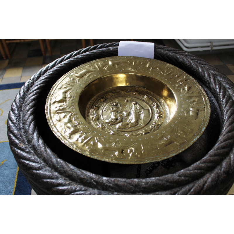 holding the inner brass basin used for baptisms