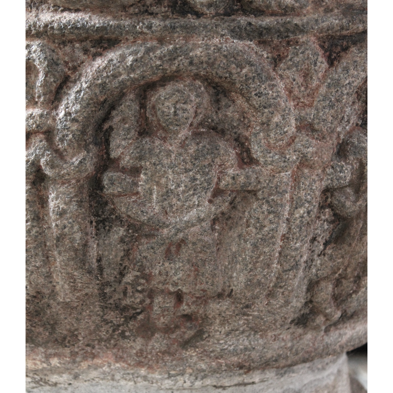 it appears to be on a cross (?) and/or with a snake around him? Could it be part of the Crucifixion scene? (it stands in the arch to the right of the one that inscribes Christ on the cross)