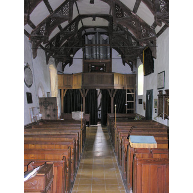 the modern font at the back, by the south doorway