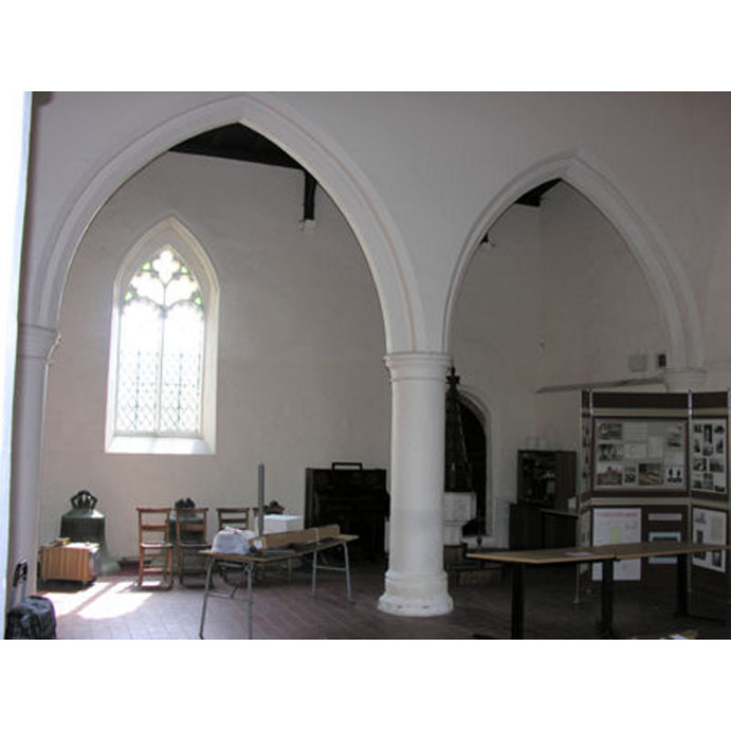 the font and cover partially visible in the south aisle, by the south door