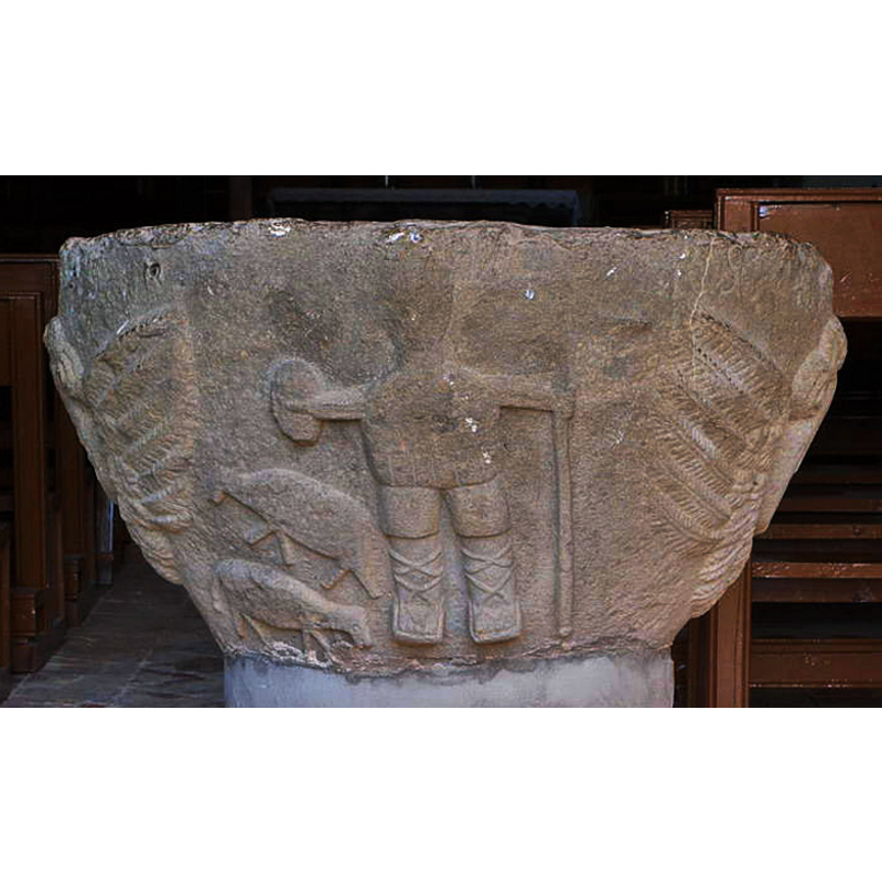 The figure is dressed in the traditional roped-up leggings and "abarca" footware of the Pyrenean shepherds; he carries a staff or short lance in one hand and a small shield or "rodela" in his other hand. At his side are sheep