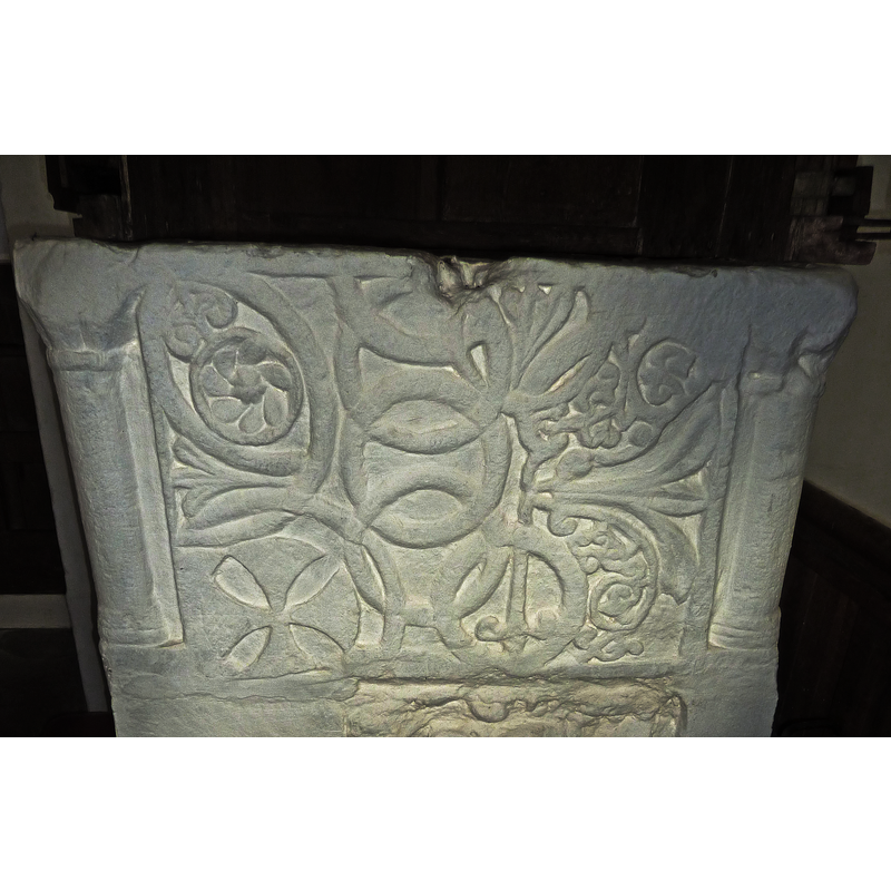 on the S side of the font, bottom left corner