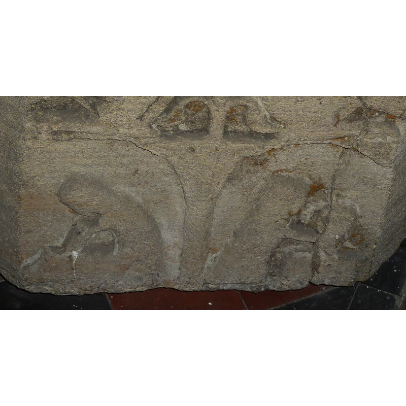 The two figures under the arches are still discernible; the double 'arch' at the top is the what remains of the tails and hind quarters of two lions.