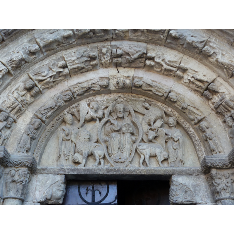 in the tympanum, Christ in Majesty with chrismon, Mary (?), four Evangelists, etc.