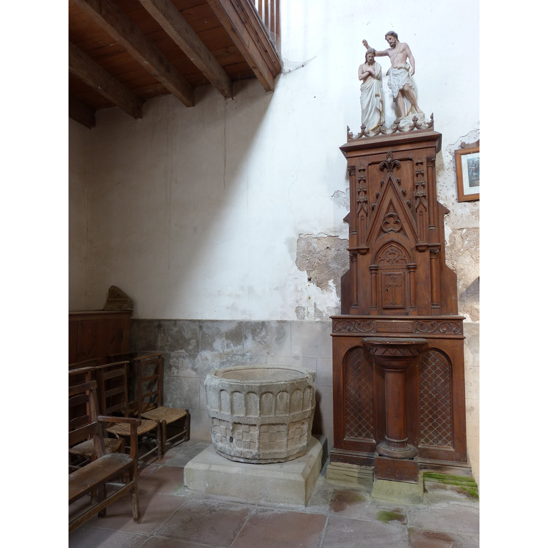 at the west end of the nave, north side; notice also the newer font in the wooden 'canopy' with the Baptism of Christ finial