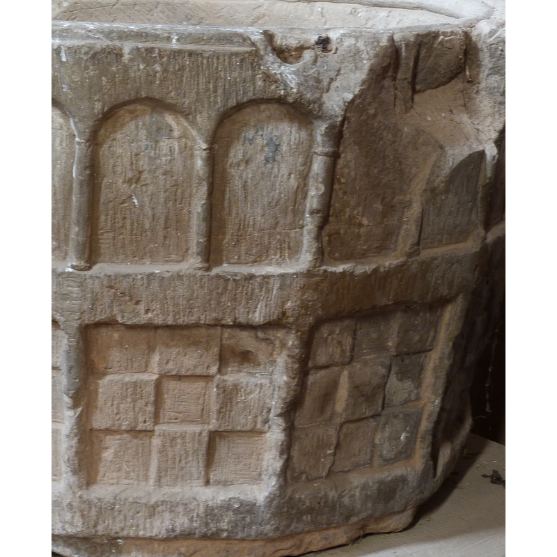 the simple mouldings of the capitals and bases of the columns can still be discerned; notice also the extensive damage on the upper rim sides
